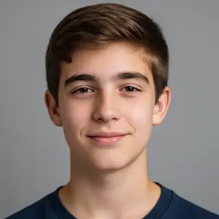 A headshot of a teenager with a relaxed, neutral face