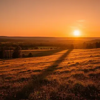 A landscape photograph bathed in golden hour light — long wa