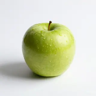 A ripe green apple on a seamless white background with soft 