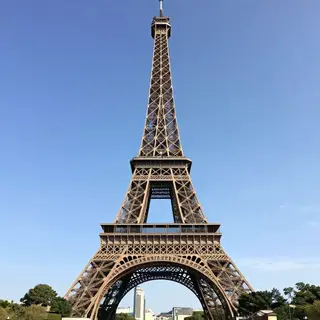 The Eiffel Tower in Paris on a clear day, architecturally ac