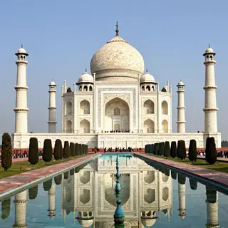 The Taj Mahal in Agra seen from the reflecting pool, with ac