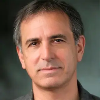A portrait of a middle-aged man with a calm, serious express