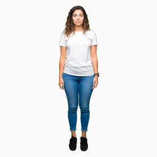 A woman standing upright in a relaxed pose, arms at her side