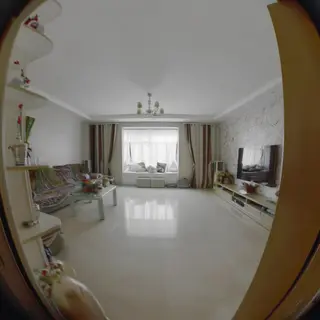 A wide-angle shot of a modern living room interior showing e