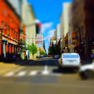 A tilt-shift photograph of a city street making real-life lo