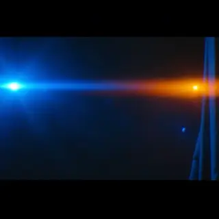 A cinematic frame with blue and orange anamorphic lens flare