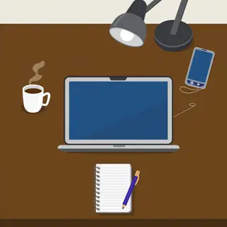 A desk scene: laptop in the center, coffee mug to the left, 