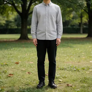 A person standing in a neutral pose in a park, full body vis