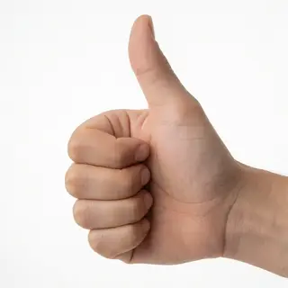 A hand giving a thumbs-up with four fingers curled and thumb