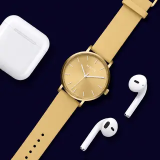 A product flat-lay on a #1A1A2E (deep dark blue) background,