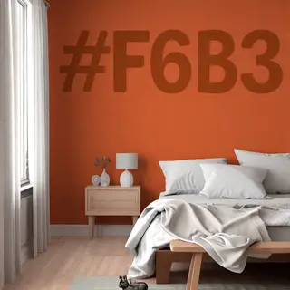 A bedroom wall painted in #FF6B35 (burnt orange) with white 