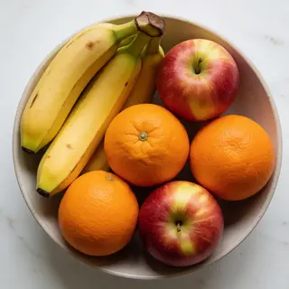 A fruit bowl containing exactly 3 bananas, 4 oranges, and 2 