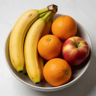 A fruit bowl containing exactly 3 bananas, 4 oranges, and 2 