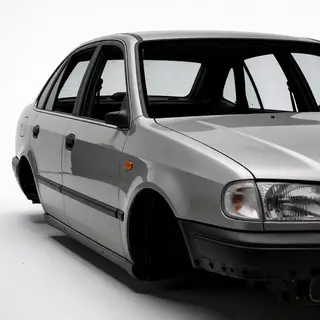 A car body with windows, doors, and headlights but no wheels