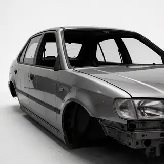 A car body with windows, doors, and headlights but no wheels