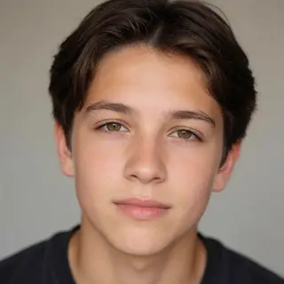 A headshot of a teenager with a relaxed, neutral face