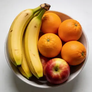 A fruit bowl containing exactly 3 bananas, 4 oranges, and 2 