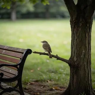 A bird perched on a branch, the branch extending from a tree