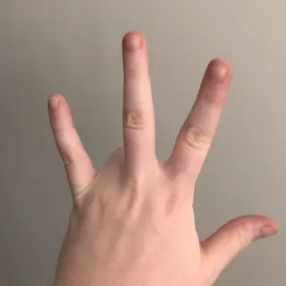 A person counting to three on their fingers, with index, mid