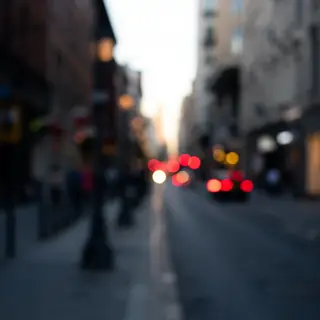 A street photograph with shallow depth of field as if shot a