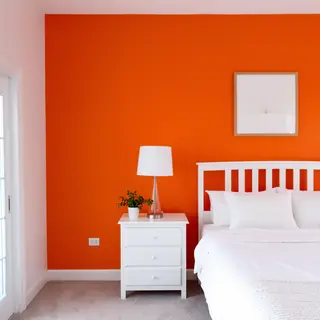 A bedroom wall painted in #FF6B35 (burnt orange) with white 