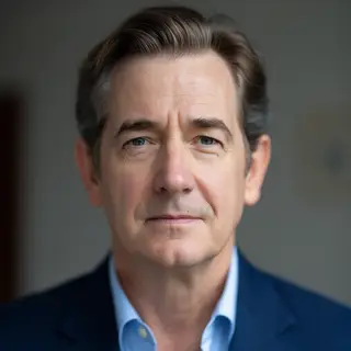 A portrait of a middle-aged man with a calm, serious express
