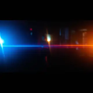 A cinematic frame with blue and orange anamorphic lens flare