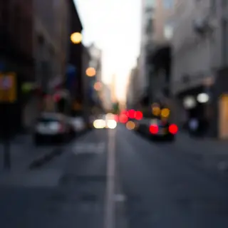 A street photograph with shallow depth of field as if shot a
