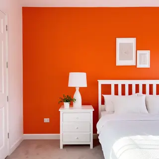 A bedroom wall painted in #FF6B35 (burnt orange) with white 