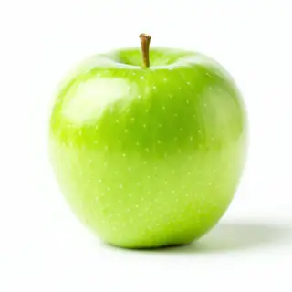 A ripe green apple on a seamless white background with soft 