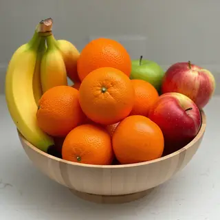 A fruit bowl containing exactly 3 bananas, 4 oranges, and 2 