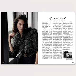 A fashion magazine spread with a full-bleed left-page photo,