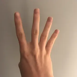 A person counting to three on their fingers, with index, mid