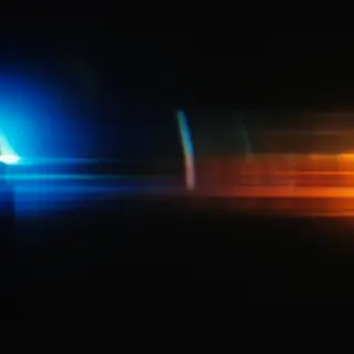 A cinematic frame with blue and orange anamorphic lens flare
