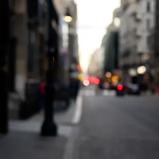 A street photograph with shallow depth of field as if shot a