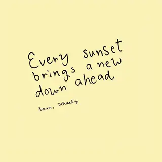 'Every sunset brings a new dawn ahead' written neatly on a p