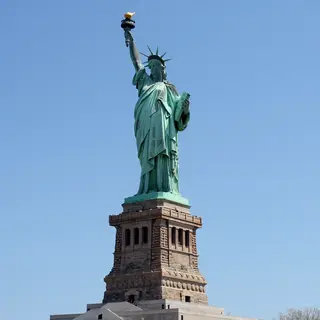 The Statue of Liberty on her island pedestal, with correct t