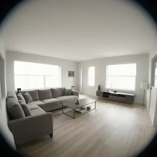 A wide-angle shot of a modern living room interior showing e