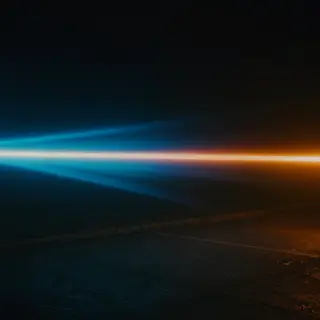 A cinematic frame with blue and orange anamorphic lens flare
