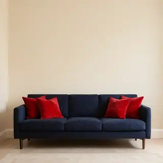 A minimalist room with walls in #F5E6CC (warm cream), a sofa