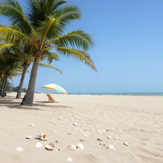 A sandy beach with palm trees, seashells, and a beach umbrel