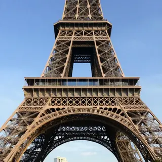 The Eiffel Tower in Paris on a clear day, architecturally ac