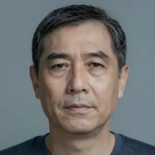 A portrait of a middle-aged man with a calm, serious express