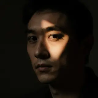 A portrait lit with classic Rembrandt lighting — triangle of