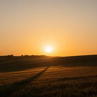 A landscape photograph bathed in golden hour light — long wa