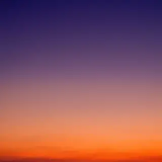A sunset sky gradient on a flat surface from #FF6B35 (orange