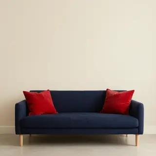 A minimalist room with walls in #F5E6CC (warm cream), a sofa