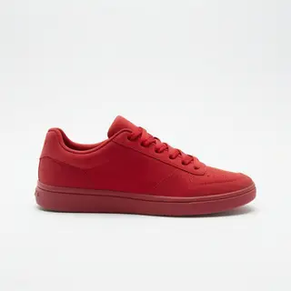 A single red sneaker on a clean white background with soft s