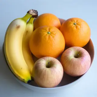 A fruit bowl containing exactly 3 bananas, 4 oranges, and 2 