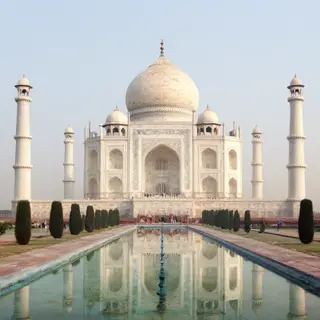 The Taj Mahal in Agra seen from the reflecting pool, with ac